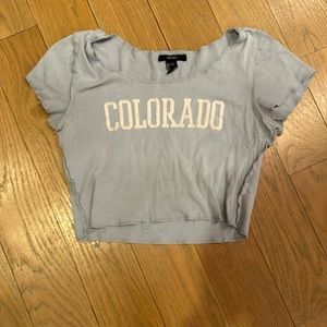 blue cute cropped shirt.